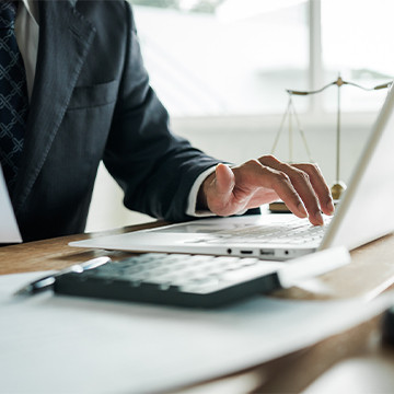 Attorney working on a laptop computer
